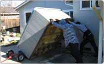 Side shot of 2 men holding up slanted spa